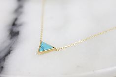 Lovely and tiny gold framed turquoise stone triangle necklace is great to wear for everyday or special occasions MATERIALS Gold plated Turquoise stone SIZE ♥ Chain Length : 16.5 '' ( as pictured ) You can CHOOSE your chain length 15 inches - 18 inches before check out ! * necklace sizes * 15 inches: around neck 16 inches: standard short 17 inches: average length 18 inches: standard long SHIPPING TIME Fast shipping within 1 - 3 days **ESTIMATED SHIPPING TIMES with the U.S.A ** Standard shipping : Turquoise Triangle Jewelry For Gifts, Turquoise Triangle Jewelry Gift, Turquoise Marble, Modern Necklace, Triangle Necklace, Triangle Pendant, Modern Necklaces, Bridesmaid Necklace, Necklace Dainty