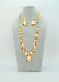 "Sabyasachi Polki Kundan Jewelry Set | Earring Necklace Set For Bridesmaid | Wedding Necklace Set | Statement Jewelry | Kundan Necklace Set A premium quality Polki Kundan Necklace set. This beautiful set is a graceful design for all Occasions.  Length of the Necklace: 7\" and The length of the necklace is adjustable by a Doori Earring Lenght Approx: 1.5\" Push-Back closure  Light-weight Micro Gold Plating on Brass base metal. Available in Stock. *Color may vary slightly due to light condition & photography. Jewelry Care:  Keep away from moisture. Allow perfumes and lotion to dry before wearing. Store in jewelry pouch. Clean only with soft lint free cloth. At Sparkling Trendz, we offer a wide range of jewelry categories such as American Diamond, CZ, Kundan, Pachi, Polki, Amrapali Inspired, White Kundan Necklace For Reception, Temple Jewelry Style, White Kundan Necklace With Hand Set Details, Hand Set White Kundan Necklace, White Kundan Necklace For Diwali Formal, Festive White Temple Necklace For Formal Occasions, Festive Formal White Temple Necklace, White Kundan Temple Necklace For Formal Occasions, White Kundan Necklace For Diwali Formal Occasions, White Kundan Necklace For Festive Reception