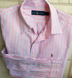 Ralph Lauren Striped Oxford Shirt Large  ...AP-AP 25" Sleeve Length 25" Multi Color  Pinke, Blue, White Excellent Pre-Owned Condition 100% Cotton  Button Down Collar Striped Shirt With Polo Collar For Spring, Ralph Lauren Striped Shirt For Spring, Ralph Lauren Cotton Polo Shirt, Casual Ralph Lauren Polo Collar Shirt, Casual Ralph Lauren Shirt With Polo Collar, Casual Ralph Lauren Polo Shirt, Ralph Lauren Fitted Striped Shirt, Spring Polo Collar Shirt With Buttons, Ralph Lauren Pink Shirt For Spring