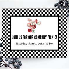 a black and white checkered business card with red flowers on it, surrounded by berries