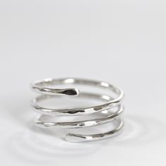 Sterling silver ring in the shape of a triple spiral, adjustable.  A very comfortable and versatile design.  The silver band can also be worn as a thumb ring for both men and women. It can be a great gift idea for a birthday or anniversary. Please, before buying, check your size carefully with a ring similar to this one. To be sure, measure the inside diameter of a similar ring and compare it with the diagram in the picture above. If you can, send me the internal diameter of your ring. If you ha Adjustable Silver Midi Rings With Modern Twist, Minimalist Sterling Silver Spiral Ring, Minimalist Spiral Sterling Silver Ring, Adjustable Sterling Silver Midi Rings With A Modern Twist, Modern Twist Adjustable Sterling Silver Midi Rings, Adjustable Spiral Ring With A Modern Twist, Adjustable Spiral Rings With A Modern Twist, Adjustable Spiral Ring With Modern Twist, Adjustable Spiral Silver Midi Rings