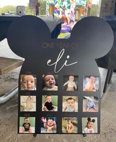 a mickey mouse shaped photo frame with the year of birth on it's side