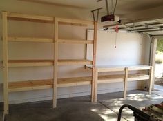 the inside of a garage with shelves and ladders