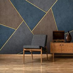 a chair sitting in front of a tv on top of a wooden dresser next to a wall