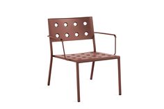 a brown chair with holes on it