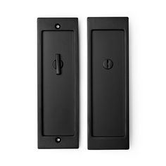 two black door handles on a white background