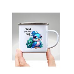 a hand holding a coffee mug with an image of a blue bird on the inside