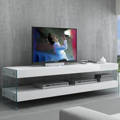 a flat screen tv sitting on top of a white entertainment center