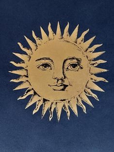 a drawing of the face of a sun on a blue background