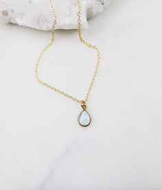 Opal necklace, dainty necklace, bridesmaid gift necklace, gold necklace, dainty necklace, birthday gift for her, birthday gifts, jewelry Gold + Opal Pendant necklace D E T A I L S: *12mm x 8mm Gold plated oval opal pendant *Gold Filled satellite beaded or cable chain *Select your perfect length SHIPPING: *Free domestic shipping on all orders PACKAGING: *All pieces come beautifully packaged, perfect for gift giving. Find more to ❤️ here: http://etsy.com/shop/thejewelrystandard Tiny Dainty Opal Jewelry, Dainty Tiny Opal Jewelry, Minimalist Hypoallergenic Pear-shaped Jewelry, Minimalist Pear-shaped Hypoallergenic Jewelry, Gold Opal Charm Necklace As Gift, Gold Teardrop Opal Necklace, Teardrop Pendant Jewelry With Adjustable Chain As Gift, Delicate Opal Jewelry Gift, Delicate Opal Jewelry For Gifts