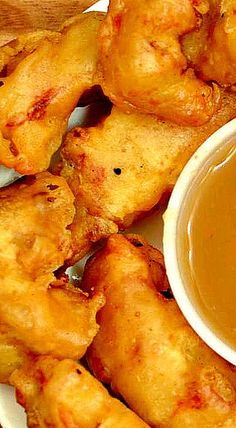 chicken wings and dipping sauce on a white plate