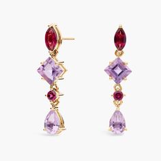 Catch the light when you wear these elegant drop earrings featuring alternating rhodolite and amethyst stones in an array of gorgeous cuts. The purple tones are accentuated by the rich gleam of the 14k yellow gold design. Purple Gem Earrings, Purple Gems, Amethyst Stones, Purple Tones, Gem Earrings, Amethyst Stone, The Purple, Gold Design, Semi Precious Gemstones