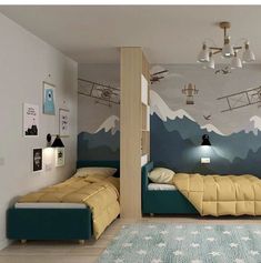 a bedroom with two twin beds and a mountain mural on the wall behind them,