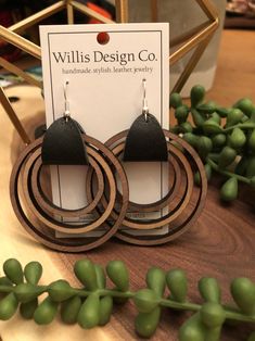 the wooden earrings are made from wood and black leather