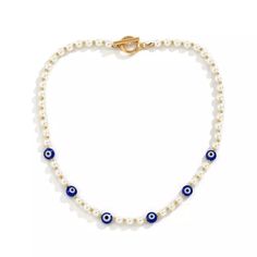 DESCRIPTION Our Evil eye pearl chain Necklace is perfect for those looking to add a bit of color to your everyday look! This would look great worn with the matching Blue Necklace or even just layered up with other necklaces as an additional accessory. We think you will love this piece as much as we do. FEATURES Synthetic pearls Gold-tone finish chain Toggle Clasp Unisex style Pearl Chain Necklace, Pearl Necklace Designs, Mens Jewelry Necklace, Beaded Choker Necklace, Evil Eye Necklace, Pearl Pendant Necklace, Blue Necklace, Men Vintage, Color Dorado