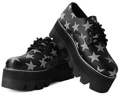 All the best party tricks start with turning the lights off. Amp up your shoe game with these Gibson style shoes featuring a vegan friendly black faux leather upper complemented by a glow in the dark star pattern print. Lace up closure and has a sole height that is approximately 2 ¼” at the heel and 1 7/8” in the front. Has removable memory foam padding for added comfort. Star Platform Shoes, Star Platform Boots, Black High-top Platform Boots With Spikes, Platform Boots With Stars, Punk Lace-up Platform Boots With Lug Sole, Black Lace-up Platform Boots With Spikes, Glow Stars, Dark Star, Shoe Last