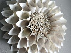 a paper flower made out of book pages