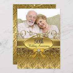 the 50th wedding anniversary card is gold and has an image of two people on it