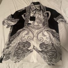 Nwt. Brand New. Never Worn. Boxy Fit. Xs, But Fits Small. Armhole To Armhole ~19.5. This Versace Shirt Features A Stunning Medusa Renaissance Square Design, Perfect For The Fashionable Man. The Shirt Is Made For Men And Is A Button-Up Type, Making It A Great Fit For Casual Occasions. The Brand Is Well-Known For Its Quality And Style, And This Shirt Is No Exception. Designer Formal Printed Tops, Designer Printed Tops For Formal Occasions, Luxury Printed Tops For Formal Occasions, Elegant Formal Tops With Graphic Print, Elegant Tops With Graphic Print For Formal Occasions, Elegant White Printed Shirt, Luxury Graphic Print Shirt For Summer, Elegant White Shirt With Graphic Print, Elegant White Printed Tops