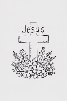 a cross with flowers on it and the word jesus written in cursive writing