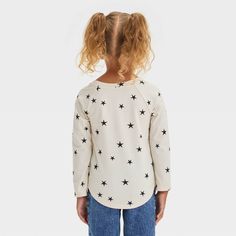 Keep your child comfy and cool in this Long-Sleeve Printed T-Shirt from Cat & Jack™. Made from cotton and recycled polyester, this mid-length T-shirt is tailored in a regular fit and showcases a crew neckline and long sleeves for a classic look. Designed in solid hue, this tee features a pullover style that makes it easy to wear. Cat & Jack™: Designed for all children so you can trust it's made for yours. Playful Soft-washed Crew Neck Tops, Playful Crew Neck Tops, Cute Long Sleeve Soft-washed Tops, Playful Relaxed Fit Soft-washed Tops, White Graphic Tee With Raglan Sleeves, Cute Soft-washed White Tops, Cute White Soft-washed Tops, White Long Sleeve Soft-washed T-shirt, White Soft-washed Long Sleeve T-shirt