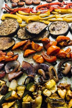 an assortment of vegetables on a tray ready to be cooked in the oven or grill