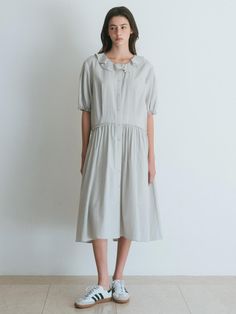 Composition : 100% cottonColor :Light GrayCountry of Origin : Republic of Korea Spring Daywear Cotton Dresses, Relaxed Fit Ruffle Dress For Daywear, Relaxed Fit Ruffled Dresses For Daywear, Cotton Dresses For Spring Daywear, Relaxed Fit Cotton Knee-length Dress, Cotton Knee-length Relaxed Fit Dress, Relaxed Fit Knee-length Cotton Dress, Cotton Knee-length Relaxed Dress, Daywear Linen Dress With Ruffles