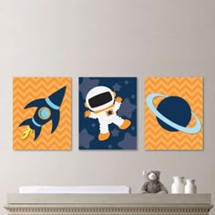 three children's wall art prints featuring an astronaut, spaceship and rocket ship