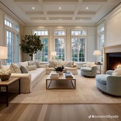 a living room filled with furniture and a fire place in the middle of a room