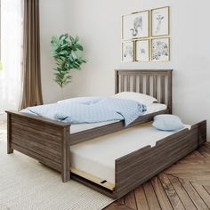 a bed that is sitting on top of a wooden floor