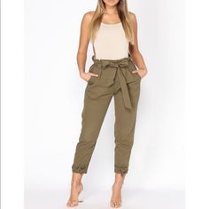 Nwt, Army Green Fashion Nova High Waist Pants. Never Worn. Perfect Condition. Size M. Ties At The Waist And At The Bottom. Bundle To Save! Ask Me How You Can Get An Extra $10 Off Of Your Order! Thanks For Stopping By! Trendy Tie Waist Pants, Chic Solid Color Cargo Pants For Spring, High-waisted Cargo Pants For Spring, High-waisted Cargo Pants For Summer Day Out, High-waisted Cargo Pants For Spring Day Out, Spring High-waisted Cargo Pants For Day Out, Spring Chic Cargo Pants, Trendy High-waisted Bottoms With Tie Waist, Chic Stretch Cargo Pants For Summer