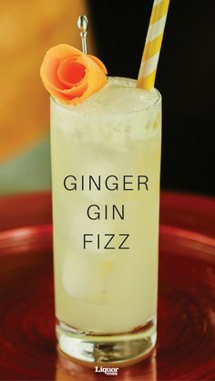 a gin fizz cocktail with an orange flower on top