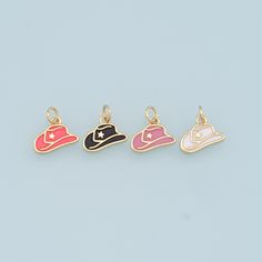 three charms with hats on them sitting next to each other