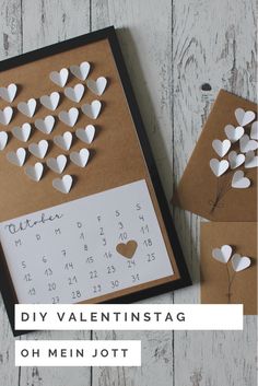 two valentine's day cards with paper hearts on them and the words diy valentinestag oh mein jot