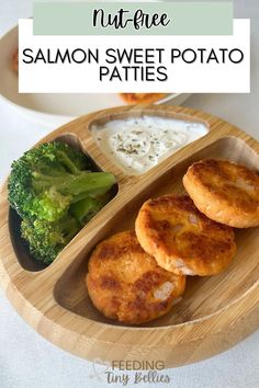 salmon sweet potato patties with ranch dip and broccoli on a wooden plate