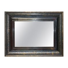 an ornate framed mirror is shown against a white background with the reflection of it's dark wood frame