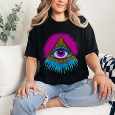 Our Comfort Colors t-shirts are of high quality and comfort, adorned with a cosmic eye set within a pyramid, emitting pink energy from the apex and turquoise blue energy from the base. They make an excellent gift for your vibrant friends or spiritual relatives. .: The Comfort Colors 1717 tee is made with medium fabric (6.1 oz/yd² (206.8 g/m consisting of high quality, 100% ring-spun US cotton for long-lasting comfort. .: The relaxed fit keeps the wearer comfy in both casual and semi-formal setti Pink Short Sleeve T-shirt For Festivals, Pink Graphic Print T-shirt For Festivals, Pink Energy, Gold Eyes, Bleu Turquoise, Dark Gold, Limassol, Design T Shirt, Back Design