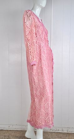 "A darling pink lace dress by JC Penney circa the 60s / 70s. It has little snaps at the sleeves, nape, and bust. There's a back zipper closure with a natural opening in the lace fabric to allow for the zipper to move. Made in the USA. Would suit a small or petite medium, but please see measurements below for accurate fit. CONDITION: Great gently worn condition. No flaws to note. MEASUREMENTS Bust: 38\" Waist: 30\" Length: 51\" Have a question? Please ask me anything." Pink Long Sleeve Lace Dress For Evening, Formal Pink Long Sleeve Lace Dress, Pink Fitted Lace Dress With Lace Sleeves, Feminine Pink Lace Dress For Formal Occasions, Fitted Pink Lace Dress With Lace Sleeves, Pink Feminine Lace Dress For Wedding, Pink Scalloped Lace Dress For Bridesmaids, Pink Long Sleeve Lace Dress For Wedding, Pink Scalloped Lace Bridesmaid Dress