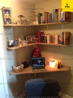 a laptop computer sitting on top of a wooden desk next to a shelf filled with books