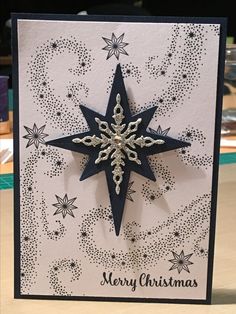 a handmade christmas card with a snowflake design on the front and bottom