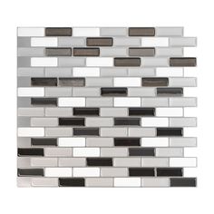 a white and black mosaic tile backsplash on a white wall with grey accents