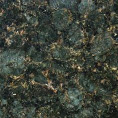 a close up view of a granite counter top with green and brown colors on it