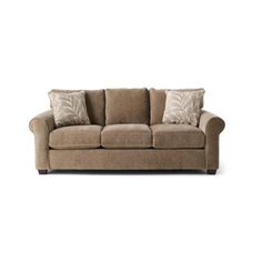 a brown couch with pillows on it