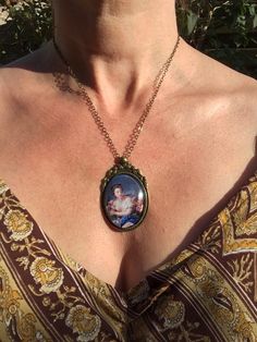 This is the first pendant in my new collection of French Rococo and baroque art! The pendant is approx. 2,2 x1,6 inch (5,5 x 4 cm) and is set in a leadfree antique brass setting. The necklace is a leadfree antique brass metal chain (length approx. 42cm). Due to the shape of the glass cabochon the light is reflected, so the real pendant is much more beautiful than the picture. The pendant is delivered in a nice gift pouch. Please feel free to follow me on instagram and Pinterest! Brass Costume Jewelry As Gift, Brass Costume Jewelry For Gifts, Vintage Adjustable Jewelry For Mother's Day, Brass Jewelry For Mother's Day Gift, Metal Pendant Jewelry For Mother's Day, Antique Cabochon Jewelry For Gifts, Antique Cabochon Jewelry As A Gift, Victorian Pendant Jewelry Gift, Victorian Bronze Jewelry Gift