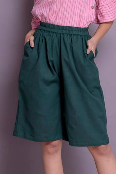 "Linen short pants, Skirt shorts, Short palazzo pants, Knee length pants, Wide leg short pants - Custom made by Modernmoveboutique. >DESCRIPTION< - Length of the pants - 24\" (61 cm) - If you want to customize the length, please mention in 'Note to seller' section while ordering these pants. - loose and roomy. - made from Linen blend. The fabric is of medium weight (185 g). - the model is 172 cm high (regular XS - S) and is wearing size S. - color or pattern in the picture - BOTTLE GREEN ( Wide Leg Shorts With Built-in Shorts, Summer Capris With Built-in Shorts, Relaxed Fit Knee-length Pants With Pockets, Knee-length Relaxed Fit Pants With Pockets, Wide Leg Bottoms With Built-in Shorts, Knee-length Bottoms With Side Pockets For Spring, Green Wide-leg Shorts With Pockets, Green Wide Leg Shorts With Pockets, Short Solid Cotton Capris