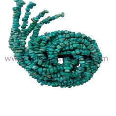 the beads are made from turquoise green glass and have small holes in each strand, which is