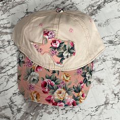 Nwt Boutique Texas Floral Baseball Cap Adjustable Strap Beautiful Distressed Floral Design And Texas State Outline In The Front Cream Color Pink Curved Brim Baseball Cap For Spring, Casual Floral Print Cap, Pink Floral Print Hat For Summer, Pink Floral Print Summer Hat, Pink Visor Hat For Spring, Casual Cotton Hats With Floral Print, Pink Cotton Trucker Hat For Spring, Spring Beige Baseball Cap, Casual Pink Adjustable Baseball Cap