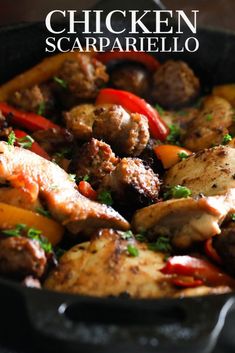 a skillet filled with meat and vegetables