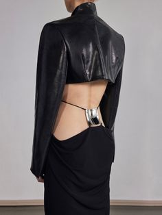 SHIPS WORLDWIDE - TAXES & DUTY ALREADY PREPAID AND INCLUDED CROPPED LEATHER BLAZER WITH SLENDER GEOMETRIC LAPELS. MADE FROM BESPOKE ITALIAN MERCURY BLACK SHINE NAPPA. HIGH SEAMLESS BACK COLLAR. HOOK CLOSURE AT THE FRONT. STYLED WITH THE VERTEBRAE BRALETTE, SQUARE LOWER BACK PLATE PILLAR SKIRT OR PEEK OPEN THIGH PANTS. 100% NAPPA LEATHER IN MERCURY BLACK BEMBERG LINING SHIPS IMMEDIATELY Jlo Dress, Mercury Black, Cropped Blazer, Back Plate, Leather Blazer, Gray Skirt, Lower Back, White Skirts, Fashion Inspo Outfits