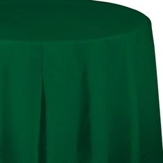 a green table cloth on top of a round table